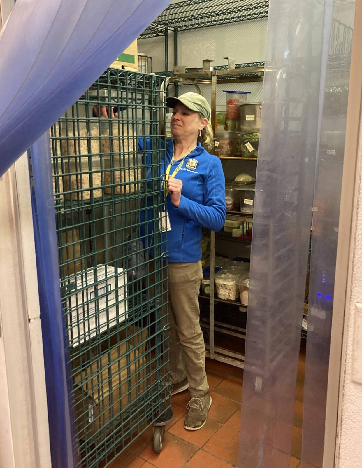 Lisa Susann, an environmental protection specialist with the Erie County Department of Health, checks the temperature of foods inside the walk-in cooler at Panera Bread, 2501 W. 12th St., on April 18.