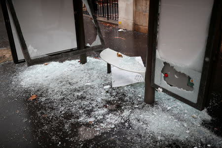 A vandalized bus stop is seen the morning after clashes with protesters wearing yellow vests, a symbol of a French drivers' protest against higher diesel fuel taxes, in Paris, France, December 2, 2018. REUTERS/Benoit Tessier