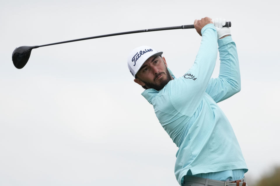 Max Homa watches his tee shot on the second hole of the South Course at Torrey Pines during the final round of the Farmers Insurance Open golf tournament, Saturday, Jan. 28, 2023, in San Diego. (AP Photo/Gregory Bull)