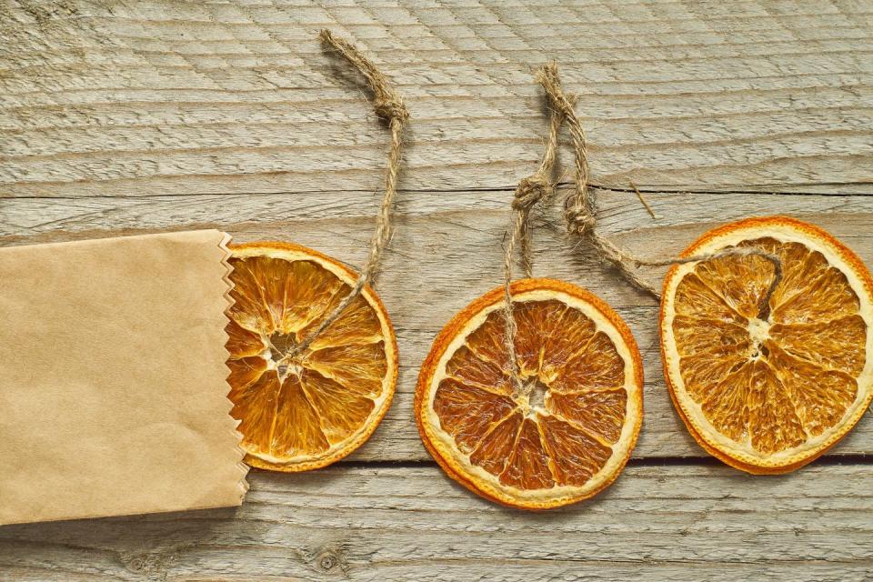 <p>"Try making your own dried fruit decorations. I use seasonal clementines that have been slowly baked on the radiator and give off a delicious festive scent - hang them from the tree with velvet ribbon."</p>