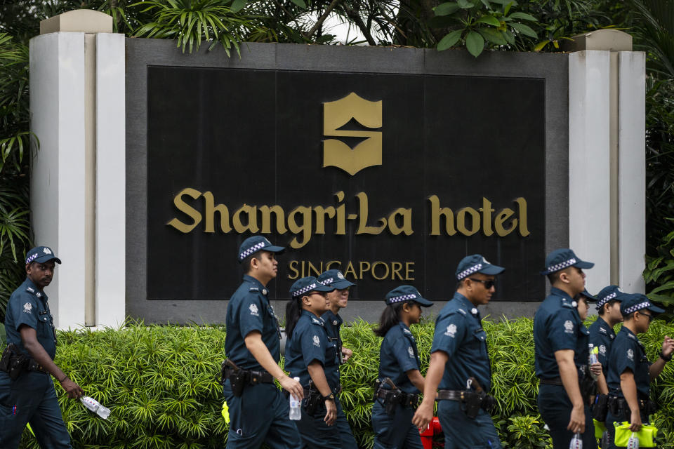 <p>Police officers patrol outside the Shangri-La Hotel in Singapore, Sunday, June 10, 2018, ahead of the summit between President Donald Trump and North Korean leader Kim Jong Un. (Photo:Yong Teck Lim/AP) </p>