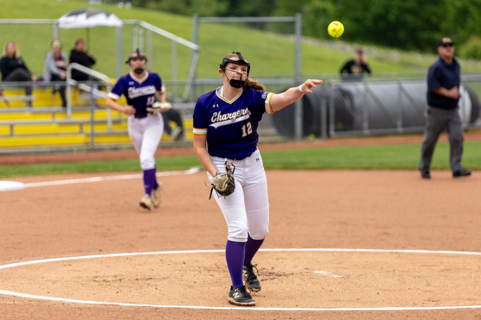 Lilli Wamsley (12) throws the ball onto first base after making a play during OLSH's first round matchup in the WPIAL Class 2A playoffs against Steel Valley Tuesday afternoon at North Allegheny High School.