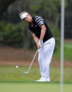 Luke Donald, of England, chips onto the seventh green during the third round of the RBC Heritage golf tournament in Hilton Head Island, S.C., Saturday, April 19, 2014. (AP Photo/Stephen B. Morton)