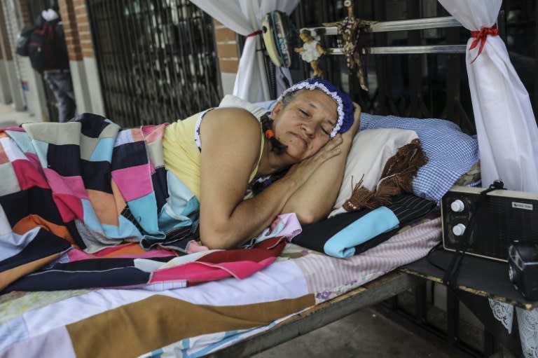 A woman snoozing on the "Day of Laziness" in Itagui, near Medellin, Colombia, on August 20, 2017