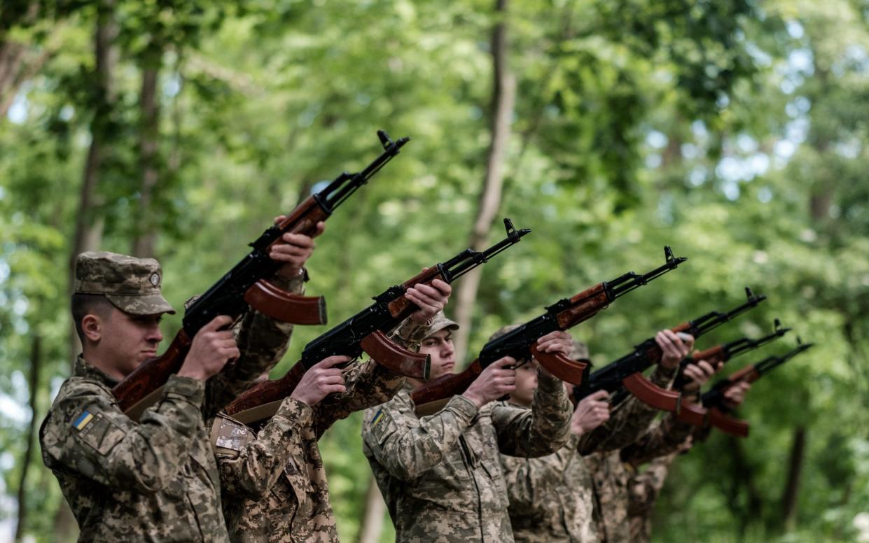 A Ukrainian guard of honour marks the country's Day of Remembrance and Reconciliation on Wednesday