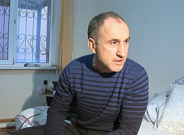 A frame grab from a video taken on April 19, 2013, shows Anzor Tsarnaev, the father of the suspected Boston bombers, brothers Tamerlan and Dzhokhar Tsarnayev, speaking with journalists at home Makhachkala, the capital Russia's North Caucasus region of Dagestan