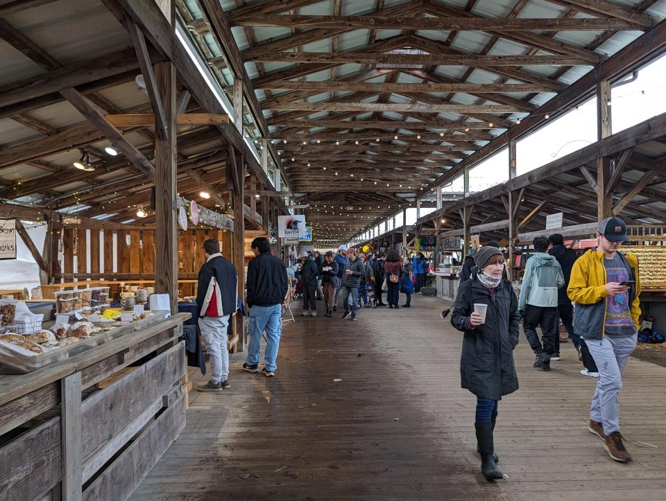 Shoppers peruse the Ithaca Farmers Market's pavilion Saturday morning.