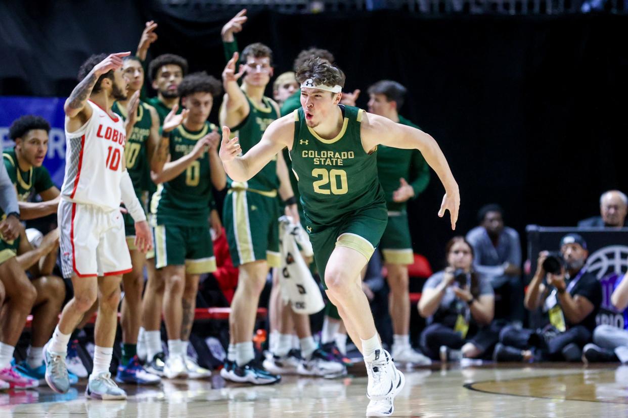 Joe Palmer #20 of the Colorado State Rams celebrates after a three-point basket against the New Mexico Lobos during the second half of a semifinal game of the Mountain West basketball tournament at the Thomas & Mack Center on Friday in Las Vegas, Nevada. The Rams will play Virginia in the First Four round of the 2024 NCAA men's basketball tournament on Thursday.