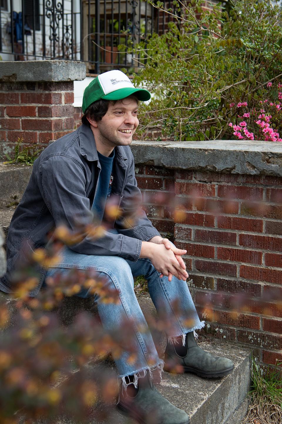 Colin Miller on the front steps of his home in Haw Creek, April 4, 2024.