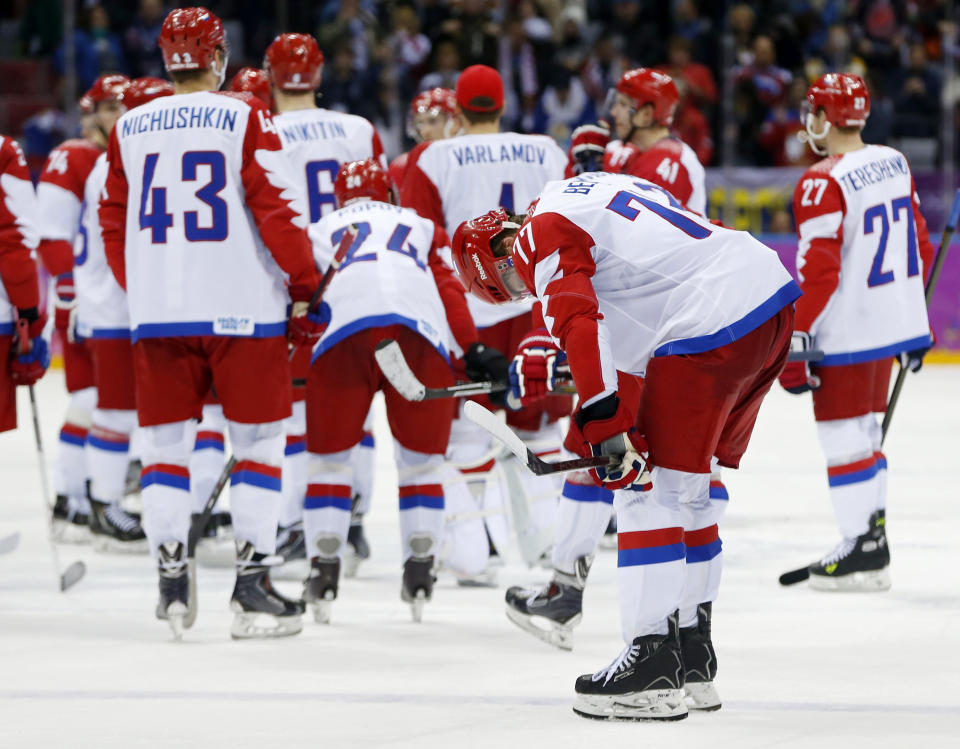 Russia defenseman Anton Belov reacts after Russia lost 3-1 to Finland in a men's quarterfinal ice hockey game at the 2014 Winter Olympics, Wednesday, Feb. 19, 2014, in Sochi, Russia. (AP Photo/Julio Cortez)