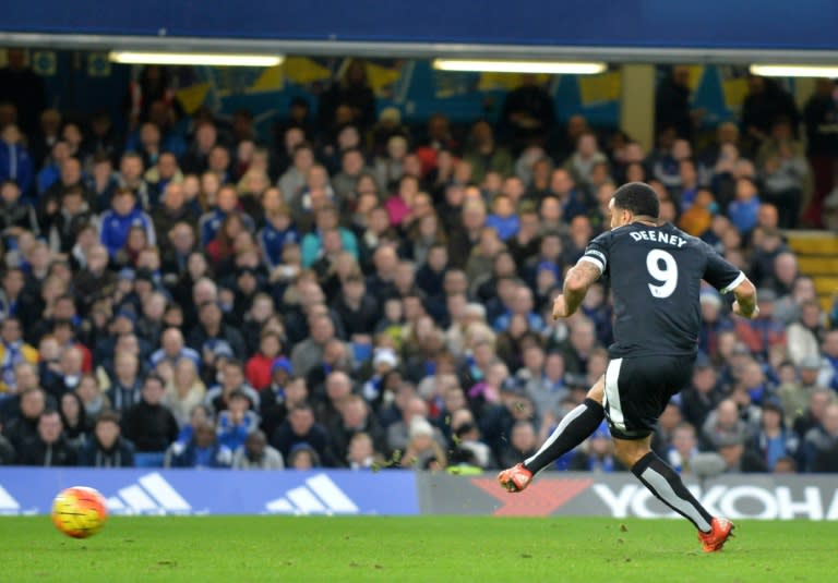 Watford's striker Troy Deeney scores from the penalty spot during an English Premier League football match against Chelsea at Stamford Bridge in London on December 26, 2015