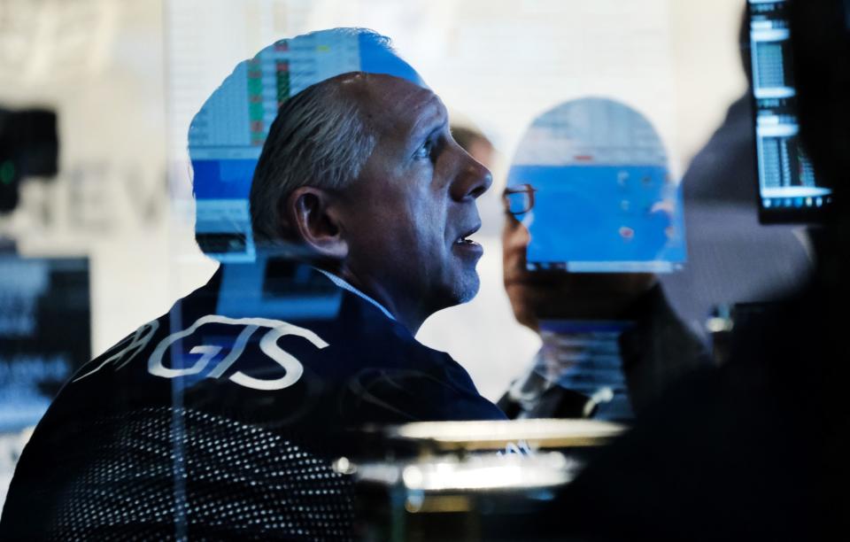 NEW YORK, NEW YORK - NOVEMBER 29: Traders work on the floor of the New York Stock Exchange (NYSE) at the start of trading on Monday following Fridays steep decline in global stocks over fears of the new omicron Covid variant discovered in South Africa on November 29, 2021 in New York City. Stocks surged in morning trading as investors get more data on the new variant and reports that symptoms have so far been mild for those who have contracted it. (Photo by Spencer Platt/Getty Images)