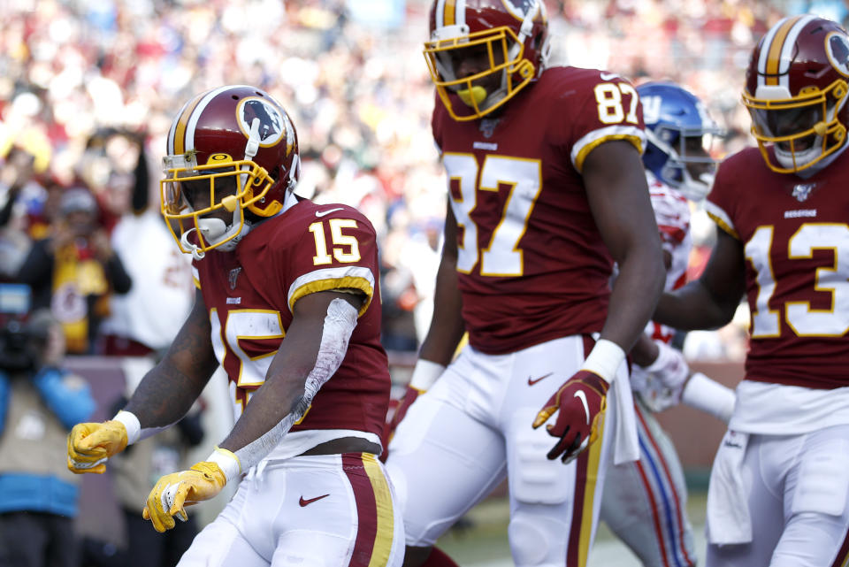 Washington Redskins wide receiver Steven Sims (15) celebrates after scoring on a touchdown pass from quarterback Dwayne Haskins, not visible, during the first half of an NFL football game against the New York Giants, Sunday, Dec. 22, 2019, in Landover, Md. (AP Photo/Patrick Semansky)