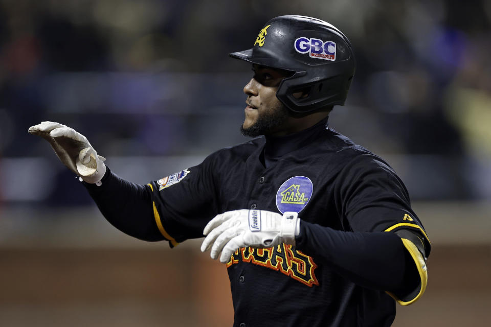 Águilas Cibaeñas' Alexander Canario reacts after hitting a sacrifice fly against Los Tigres del Licey during the eighth inning of a Dominican Winter League baseball game Friday, Nov. 10, 2023, in New York. (AP Photo/Adam Hunger)