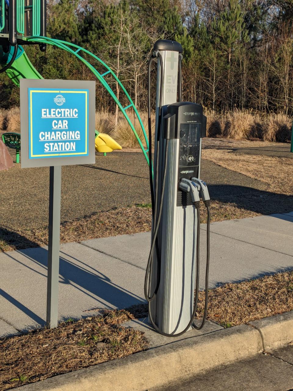 An EV charger sits ready to use at the Hawthorne at the Station apartment complex off Military Cutoff Road in Wilmington. Some apartment complexes in the region have added EV chargers to their parking lots as an amenity to attract potential renters.