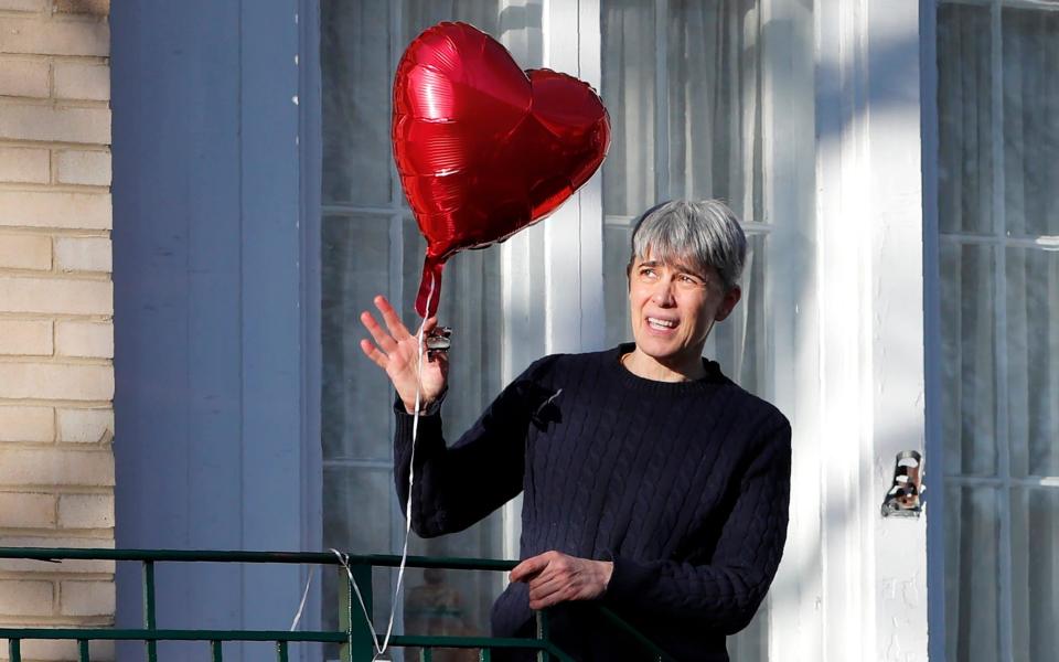 Former Illinois Gov. Rod Blagojevich's sister-in-law Deb Mell talks to reporters from the porch of the Blagojevich home in Chicago - AP