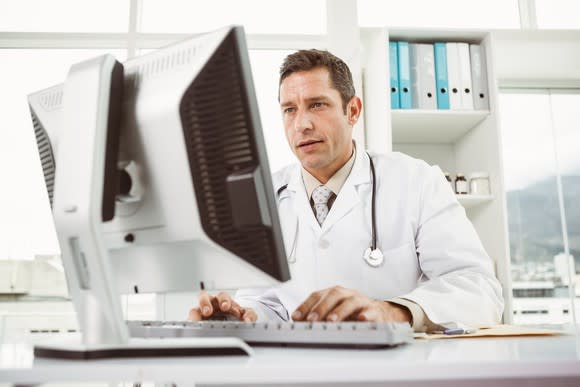 Doctor looking at a computer screen