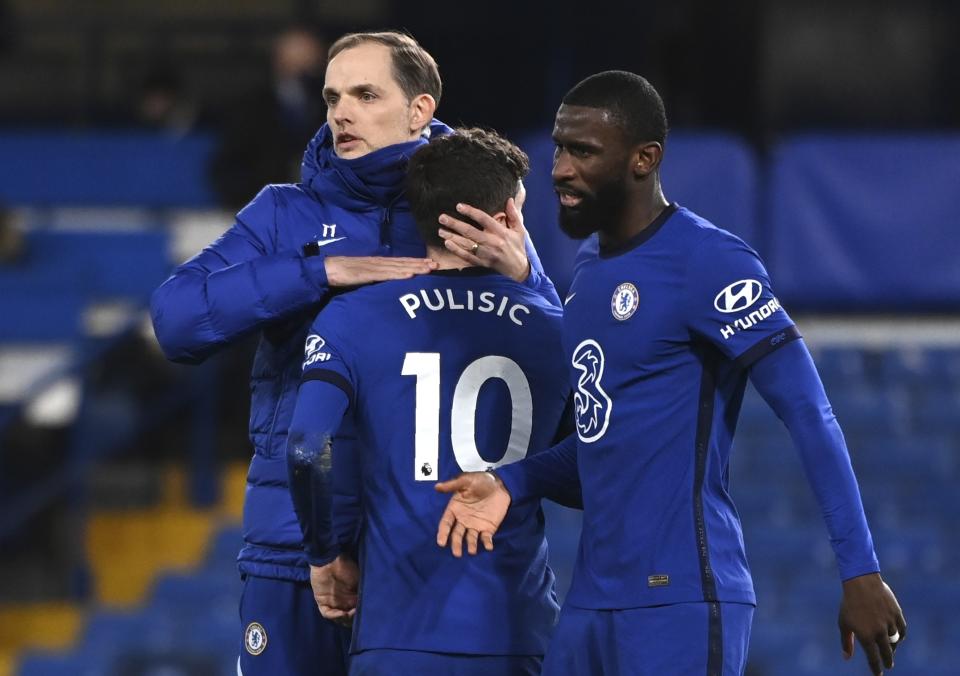 Chelsea's head coach Thomas Tuchel, left, Chelsea's Christian Pulisic, centre, and Chelsea's Antonio Rudiger react after the English Premier League soccer match between Chelsea and Manchester United at Stamford Bridge Stadium in London, England, Sunday, Feb. 28, 2021. (Andy Rain/Pool via AP)