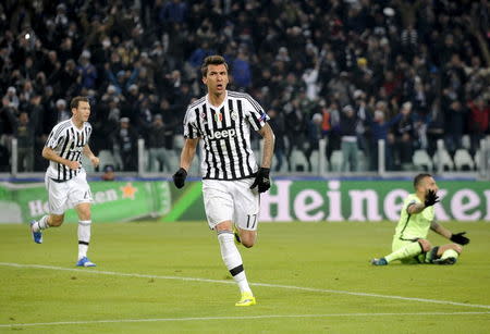 Football Soccer- Juventus v Manchester City - UEFA Champions League Group Stage - Group D - Juventus stadium, Turin, Italy - 25/11/15 Juventus' Mario Mandzukic (C) celebrates after scoring the first goal for Juventus. Reuters/Giorgio Perottino