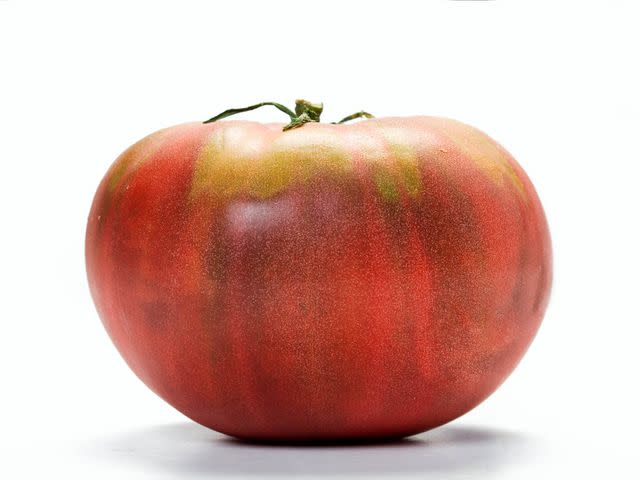 <a href="https://www.shutterstock.com/image-photo/isolated-dark-red-heirloom-tomato-34139527" data-component="link" data-source="inlineLink" data-type="externalLink" data-ordinal="1">Shutterstock</a>