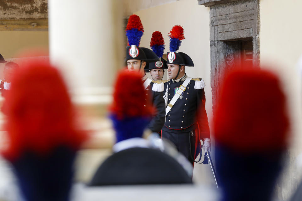 Carabinieri officers prepare before the start of the funeral for slain policeman Mario Cerciello Rega, in his hometown of Somma Vesuviana near Naples, southern Italy, Monday, July 29, 2019. Investigators say two young American tourists have confessed to fatally stabbing the Italian paramilitary policeman while he was investigating the theft of a bag. (AP Photo/Andrew Medichini)