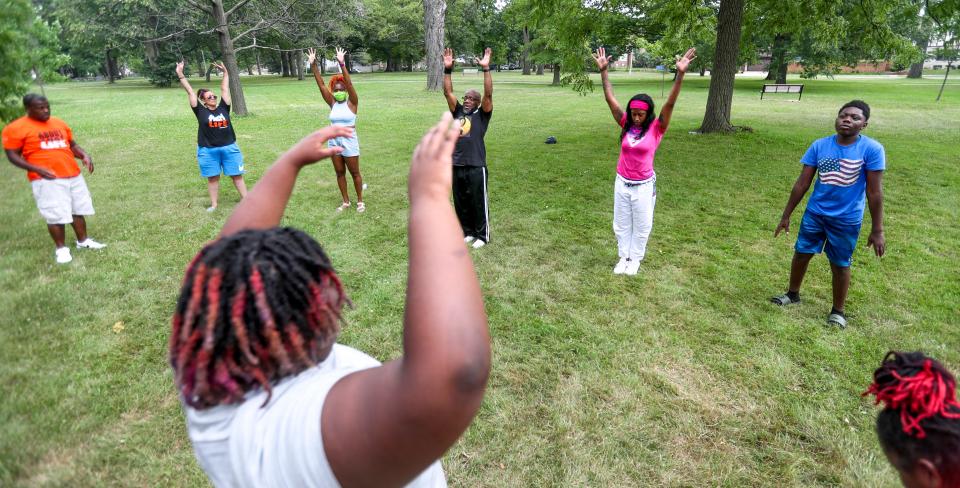 Alphonso Pettis, personal safety instructor, warms up with a group at Sherman Park in Milwaukee in 2021.