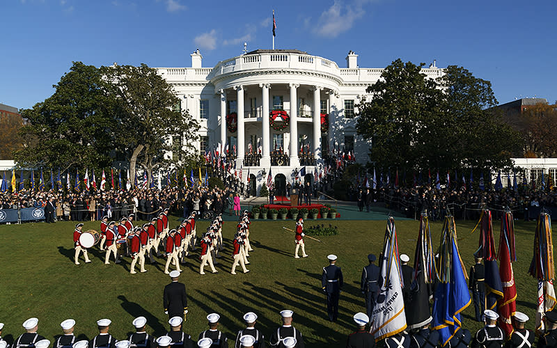 The Army Old Guard Fife and Drum Corp perform during an arrival ceremony for French President Emmanuel Macron and first lady Brigitte Macron on the South Lawn of the White House on Dec. 1. <em>Greg Nash</em>