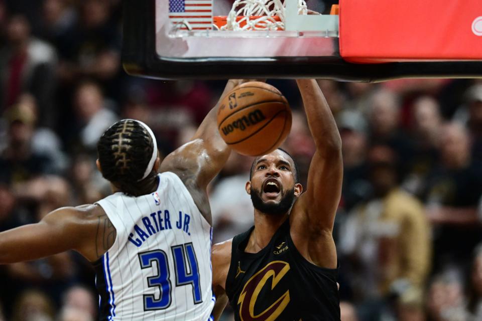 Cavaliers forward Evan Mobley dunks on Magic center Wendell Carter Jr. (34) during the second half in Game 5 of a first-round NBA playoff series, April 30, 2024, in Cleveland.