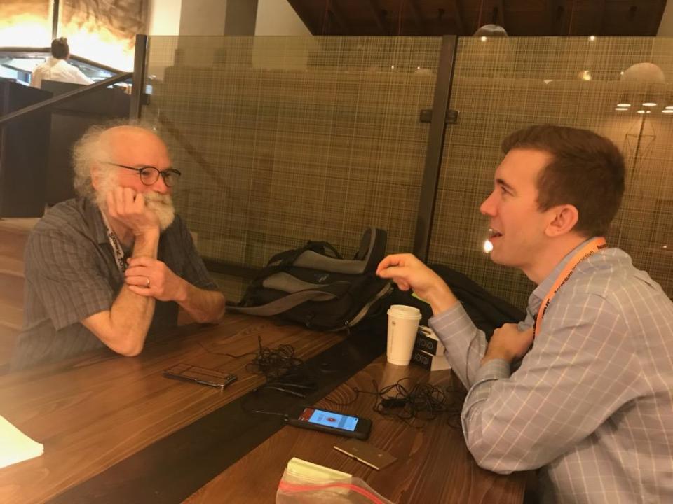 A photo of IBM fellow John Cohn speaking with Motley Fool Explorer advisor Simon Erickson