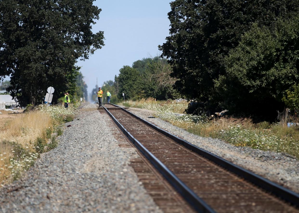 Three people died Wednesday night when the driver of the car they were in attempted to cross railroad tracks near Gervais and was struck by a Union Pacific freight train.