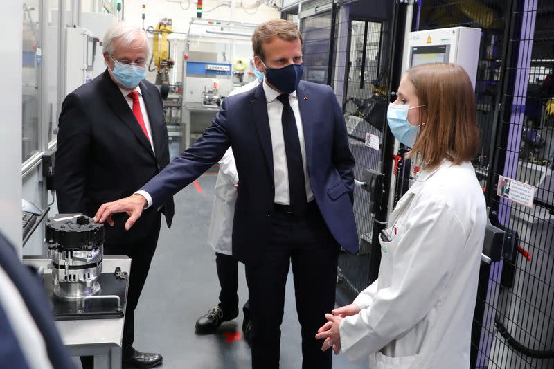 French President Emmanuel Macron visits a factory of manufacturer Valeo, in Etaples