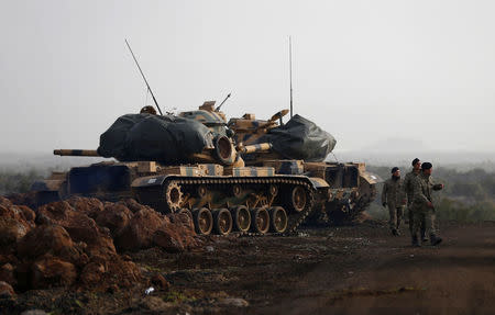 Turkish soldiers and tanks are pictured in a village on the Turkish-Syrian border in Gaziantep province, Turkey January 22, 2018. REUTERS/Osman Orsal