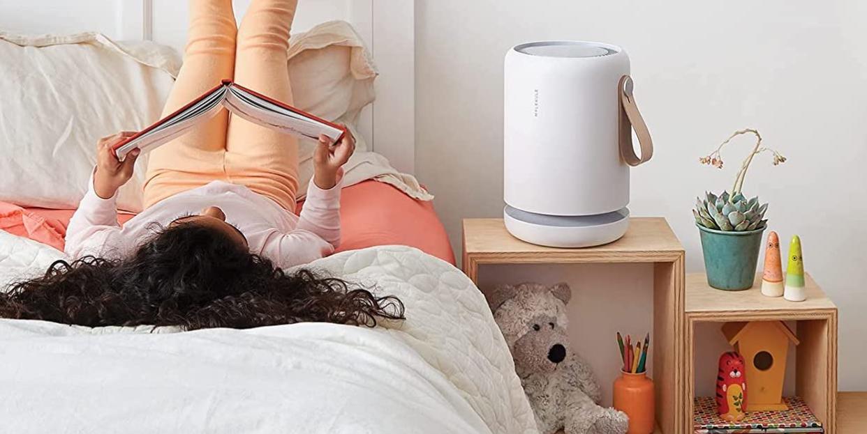 child reading, air purifier