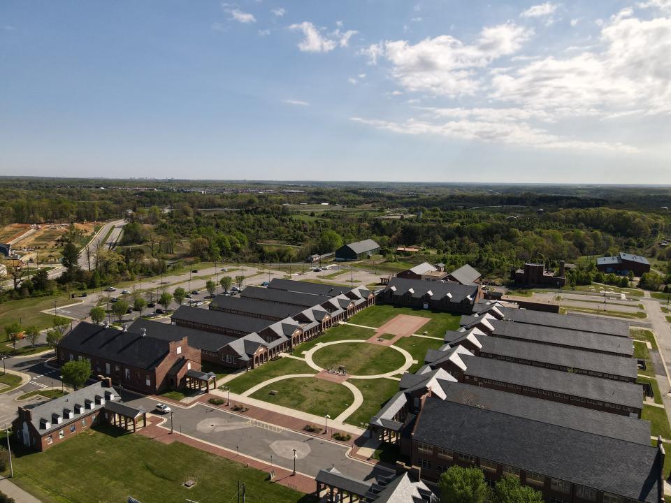 “While we were in [Lorton], they had started developing around the prison. We knew it was a matter of time before the prison was going to shut down because the land was in a prime location,” shares Karim Mowatt. Seen here, an aerial view of the now Workhouse Art Center, which includes the Lucy Burns Museum.