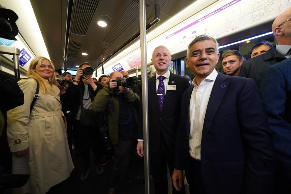 Mayor of London Sadiq Khan and Andy Byford, Commissioner at Transport for London, travel on the first Elizabeth line train to carry passengers at Paddington Station (Kirsty O’Connor/PA) (PA Wire)