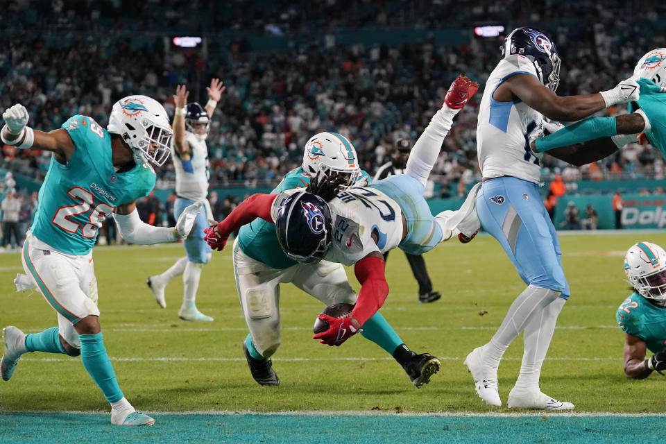 Tennessee Titans running back Derrick Henry (22) scores a touchdown during the second half of an NFL football game against the Miami Dolphins, Monday, Dec. 11, 2023, in Miami. (AP Photo/Lynne Sladky)