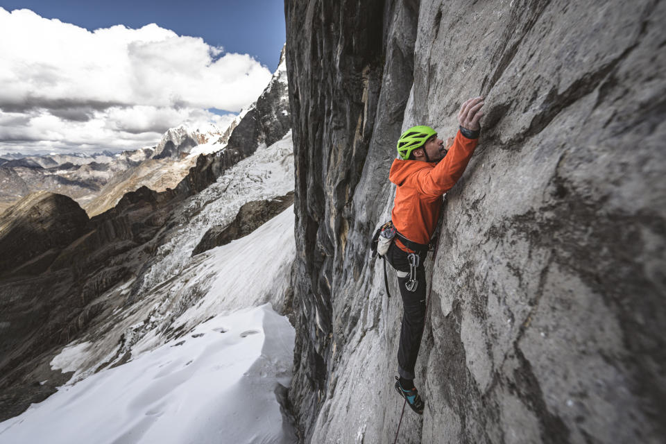 <span class="article__caption">Wharton pulling hard on the lower limestone wall. The first 11 pitches were all rock climbs, nine of which were 5.10 or harder.</span> (Photo: Drew Smith)