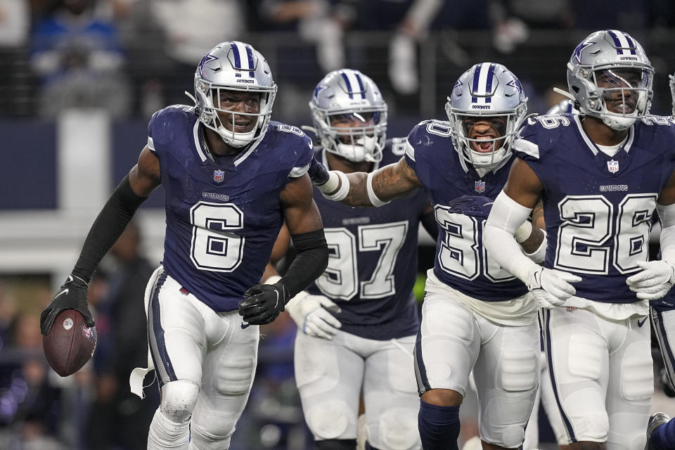 Dallas Cowboys safety Donovan Wilson (6) holds the ball after intercepting a pass by Detroit Lions quarterback Jared Goff during the second half of an NFL football game, Saturday, Dec. 30, 2023, in Arlington, Texas. (AP Photo/Sam Hodde)