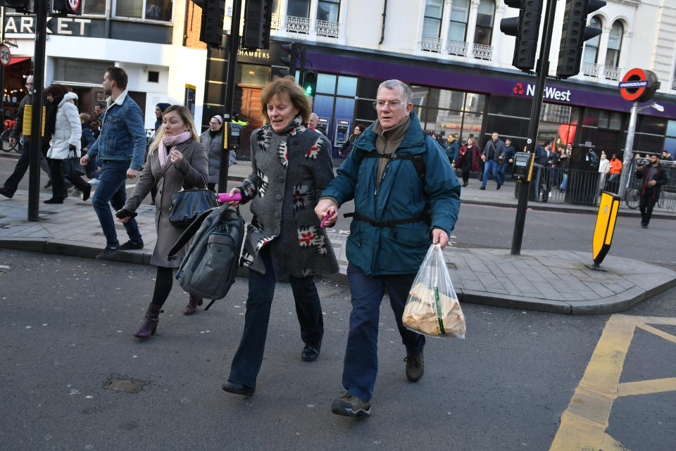 People heading away from the vicinity of Borough Market in London after police told them to leave the area.