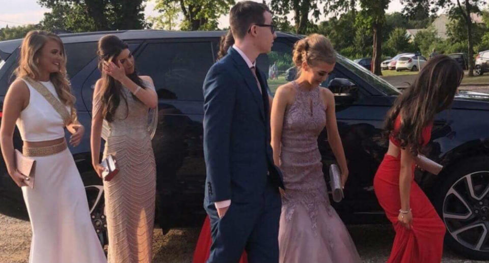 A group of girls have been praised for inviting Brodie Smith, who was born with autism, to prom with them. Source: Supplied/Nicky Byrne