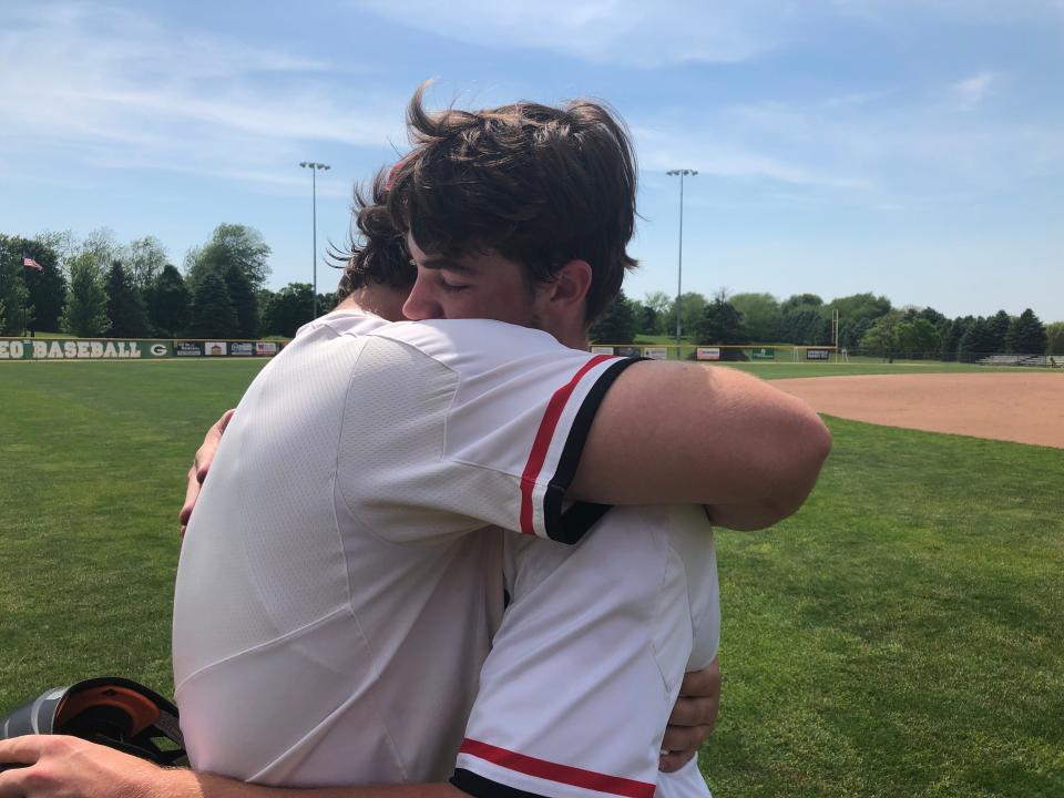 Brimfield-Elmwood senior teammates Frank Kelch and Drew Bryant (right) embrace on the field after their final high school game ended in a 10-0 loss to Joliet Catholic in the IHSA Class 2A Geneseo Supersectionals on Monday, May 30, 2022 at Bollen Field.