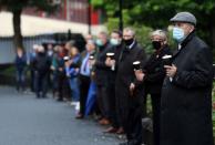 Mourners waiting for the funeral procession of John Hume gather outside St Eugene's Cathedral in Londonderry