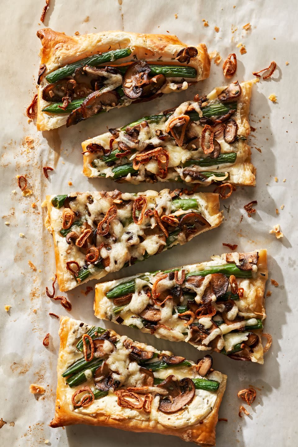 cheesy green bean and mushroom tart with crispy shallots