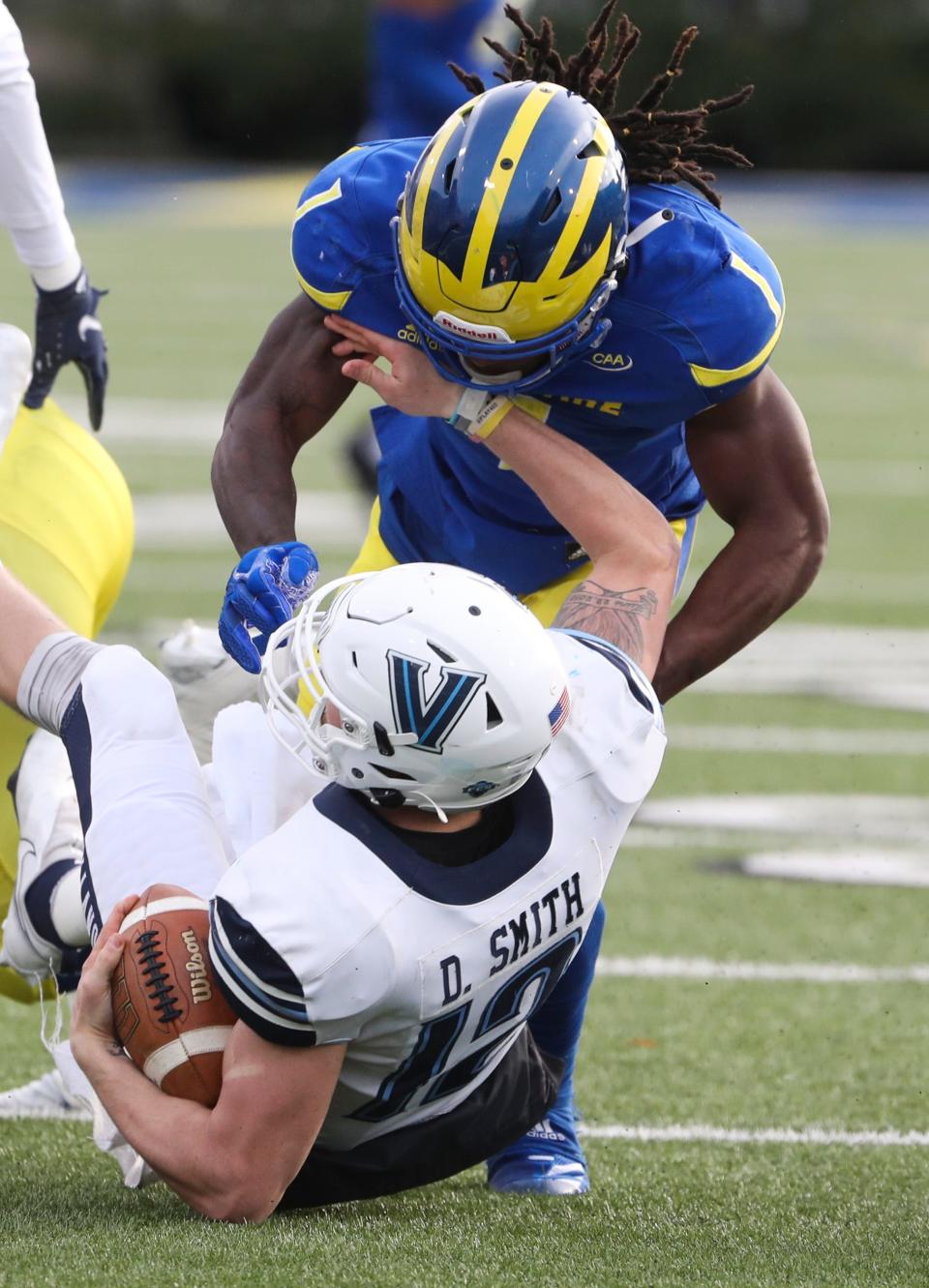 Delaware's Kedrick Whitehead drops Villanova quarterback Daniel Smith in the third quarter of the Blue Hens' 21-13 loss at Delaware Stadium, Saturday, Nov. 20, 2021.