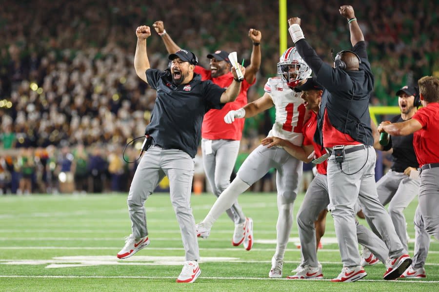 SOUTH BEND, INDIANA – SEPTEMBER 23: Head coach Ryan Day of the Ohio State Buckeyes celebrates a rushing touchdown by Chip Trayanum #19 during the fourth quarter against the Notre Dame Fighting Irish at Notre Dame Stadium on September 23, 2023 in South Bend, Indiana. (Photo by Michael Reaves/Getty Images)