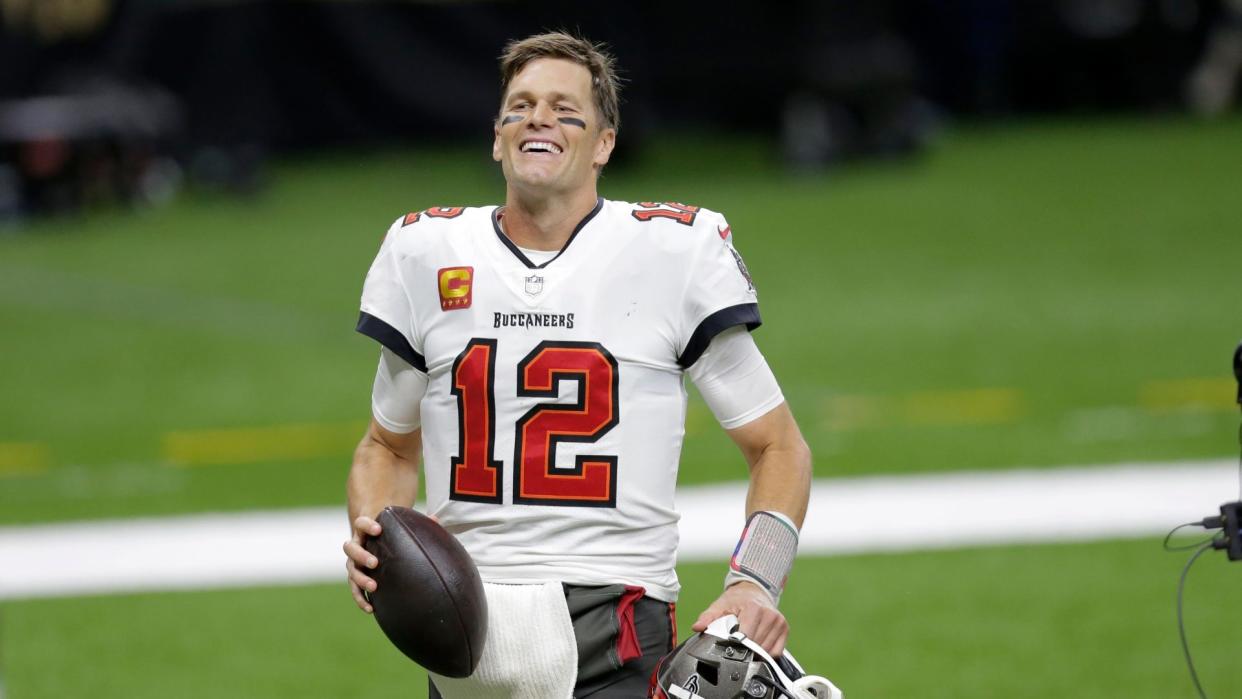 Mandatory Credit: Photo by Brett Duke/AP/Shutterstock (11713998br)Tampa Bay Buccaneers quarterback Tom Brady smiles after an NFL divisional round playoff football game against the New Orleans Saints, in New Orleans.