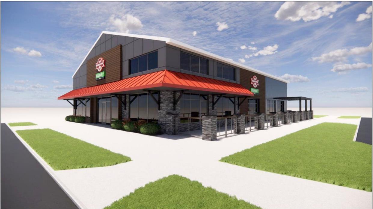 This is an architectural rendering of the proposed exterior of the proposed Prized Pig/Bourbon Street Pizza family restaurant with outside seating. The site at Liberty Drive and Mishawaka Avenue would be renovated for an eventual opening in the summer or fall of 2024.