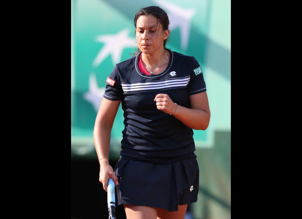 France's Marion Bartoli reacts after winning over Czech Karolina Pliskova during their women's Singles 1st Round tennis match of the French Open tennis tournament at the Roland Garros stadium.      (KENZO TRIBOUILLARD/AFP/GettyImages)