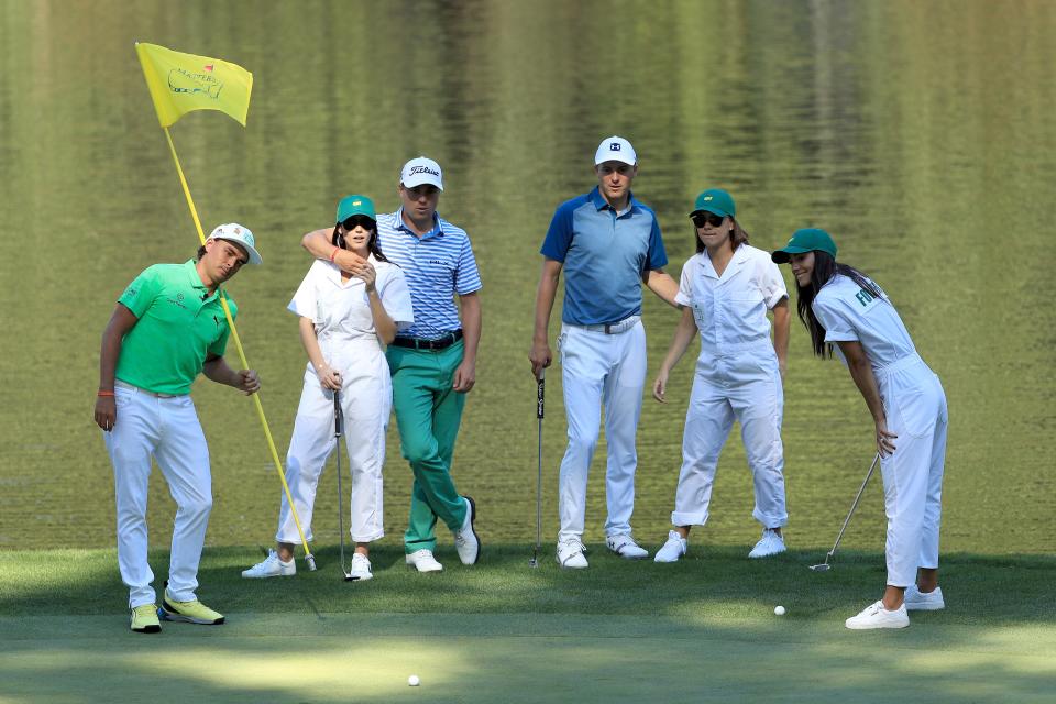 AUGUSTA, GEORGIA - APRIL 10: (L-R) Rickie Fowler of the United States, Jillian Wisniewski, Justin Thomas of the United States, Jordan Spieth of the United States, Annie Verret, and Allison Stokke watch a putt during the Par 3 Contest prior to the Masters at Augusta National Golf Club on April 10, 2019 in Augusta, Georgia. (Photo by Mike Ehrmann/Getty Images)