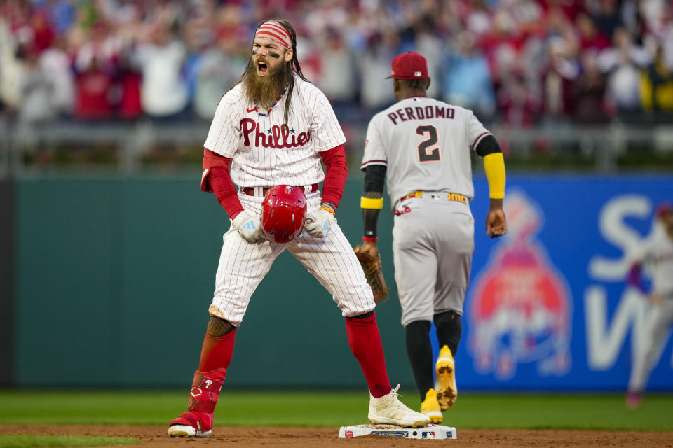 Philadelphia Phillies' Brandon Marsh celebrates his RBI-single against the Arizona Diamondbacks during the second inning in Game 6 of the baseball NL Championship Series in Philadelphia Monday, Oct. 23, 2023. (AP Photo/Matt Slocum)